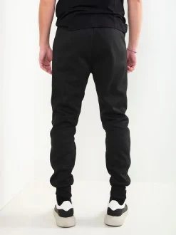 Calças jogger pretas com estampado