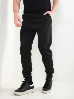 Calças jogger pretas com estampado