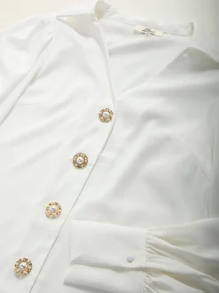 Camisa acetinada com manga abalonada
