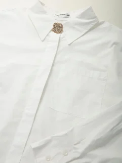 Camisa oversize com botão dourado