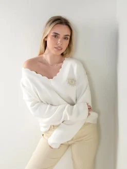 Camisola malha em V com botões dourados